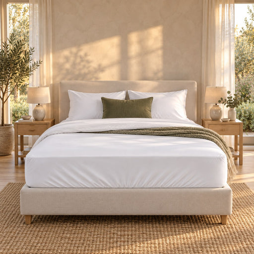 The Huxberry ActivChill 5-Sided Mattress Protector on a bed, seen straight on from the foot