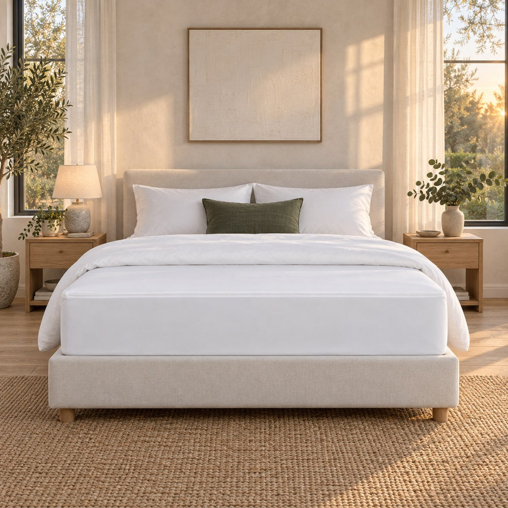 The Huxberry ActivGuard Mattress Encasement on a bed, seen straight on from the foot