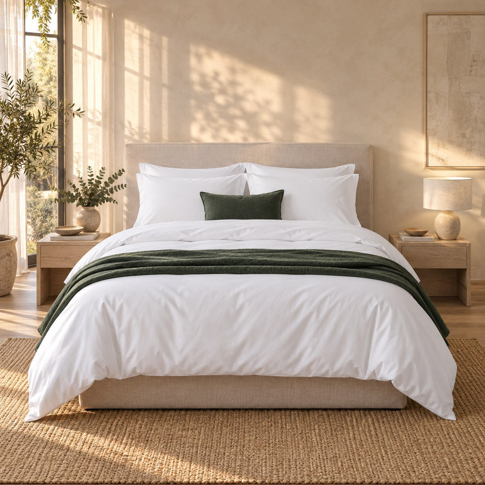 A made bed dressed in the Huxberry Organic Cotton Bedding Bundle