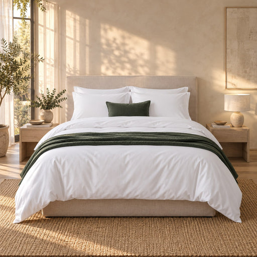 A made bed dressed in the Huxberry Organic Cotton Bedding Bundle