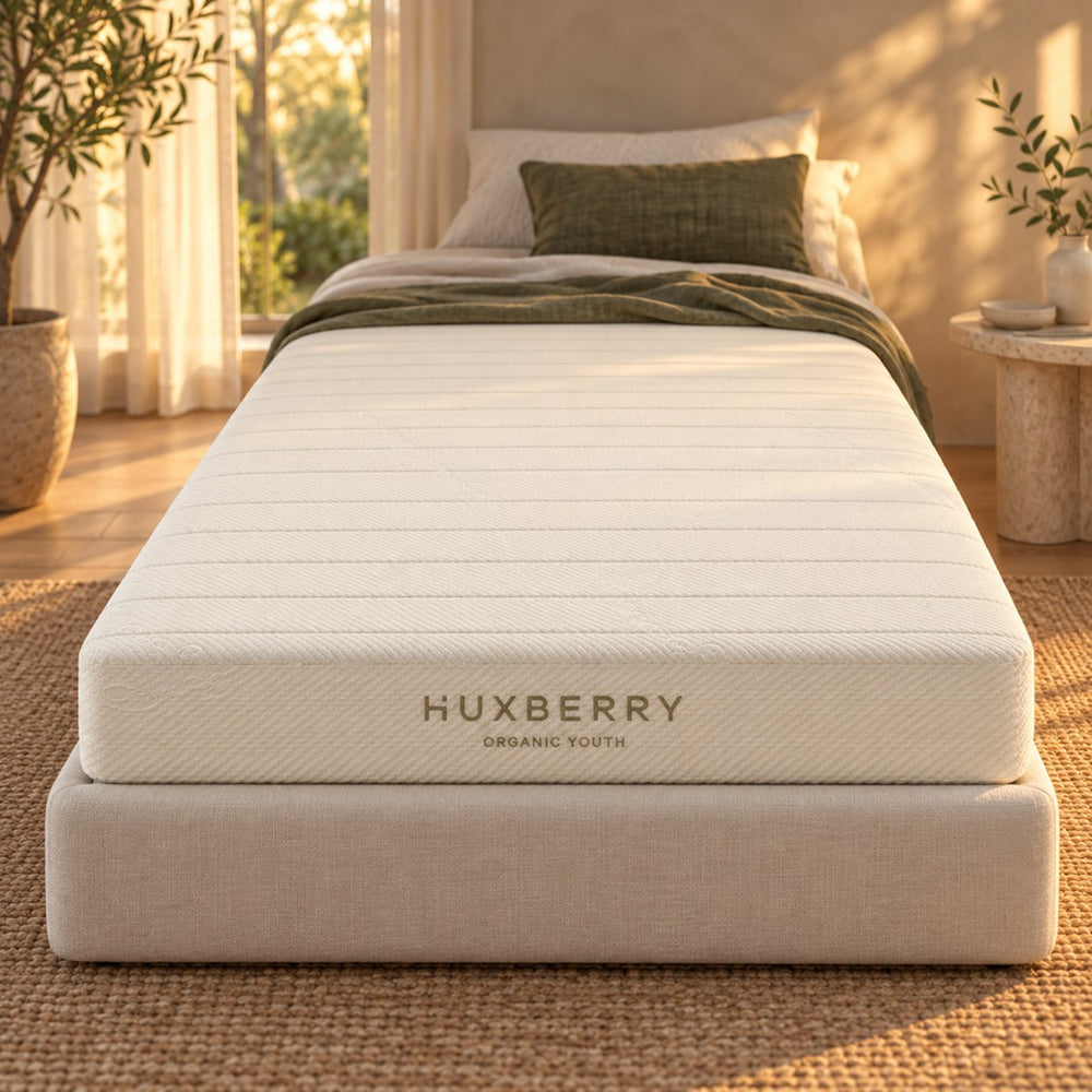 Close-up of the Huxberry Organic Latex Youth Mattress edge, quilting and embroidered name