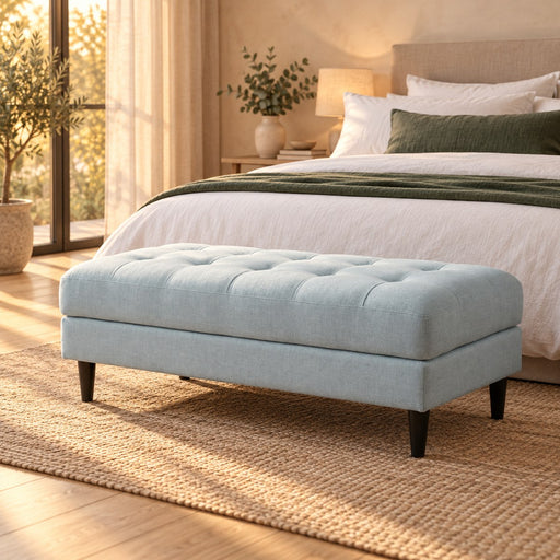 Huxberry Paris Ottoman in a warm, light bedroom