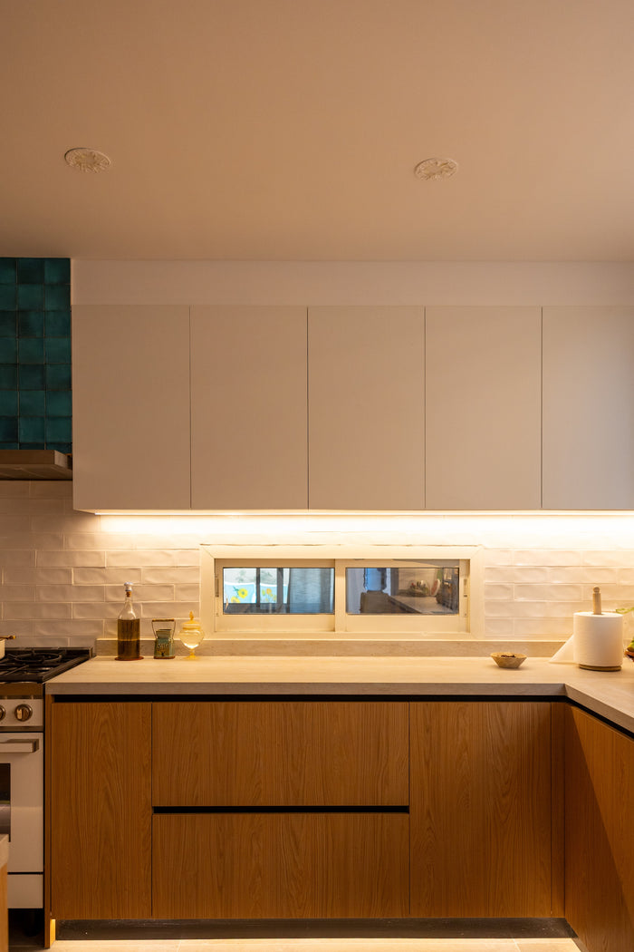 Huxberry bespoke oak kitchen at dusk, Abu Dhabi