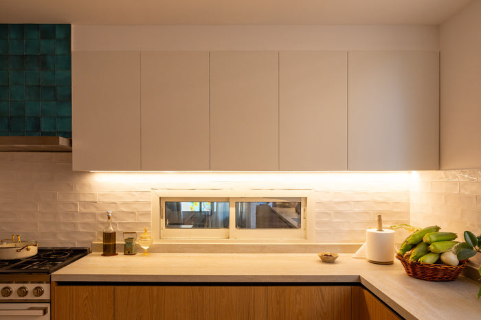 Huxberry bespoke oak kitchen at dusk, Abu Dhabi