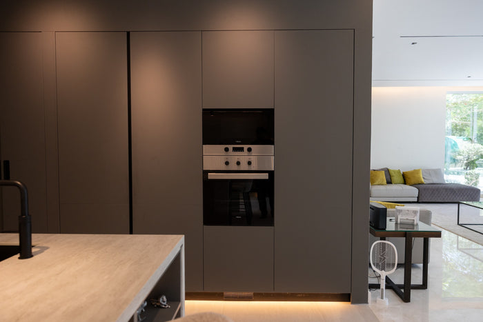 Huxberry bespoke graphite and travertine kitchen, Victory Heights, Dubai