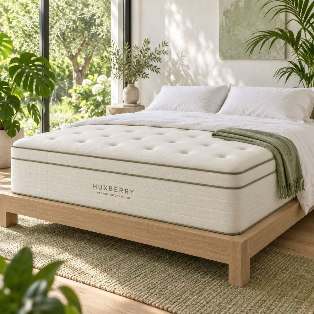 Organic Luxury Plush Mattress in a bright, plant-filled bedroom