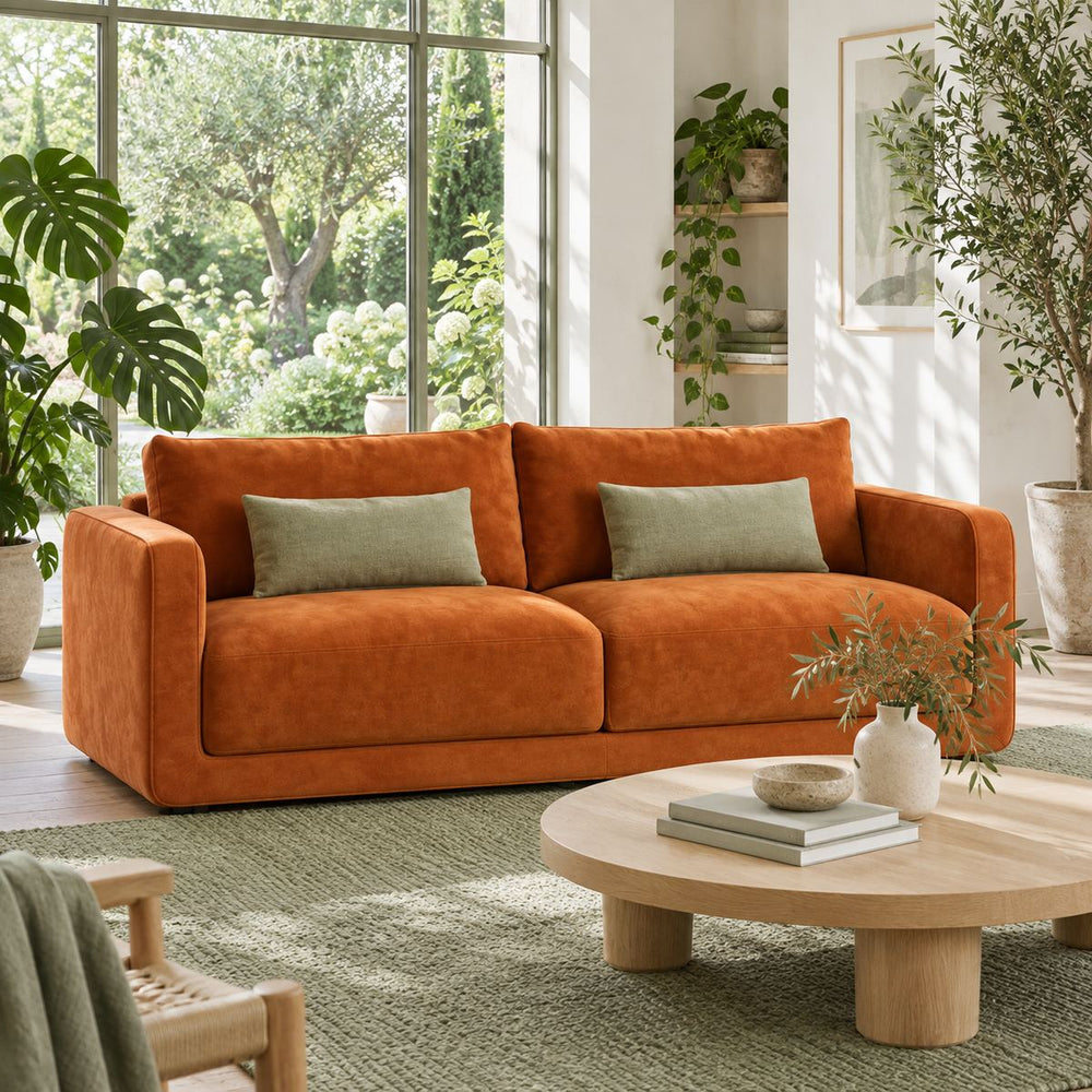 Roma Sofa in a bright, plant-filled living room