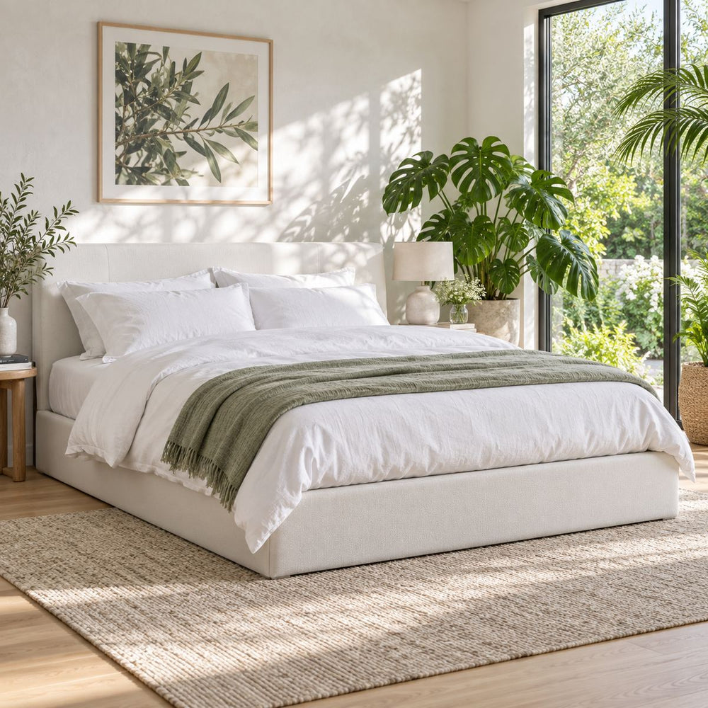 Hydraulic Storage Bed in a bright, plant-filled bedroom