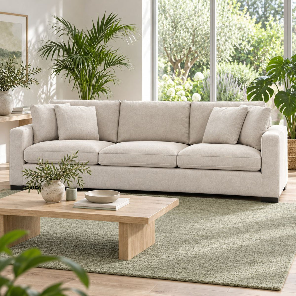 Calvin 3 seater Sofa in a bright, plant-filled living room