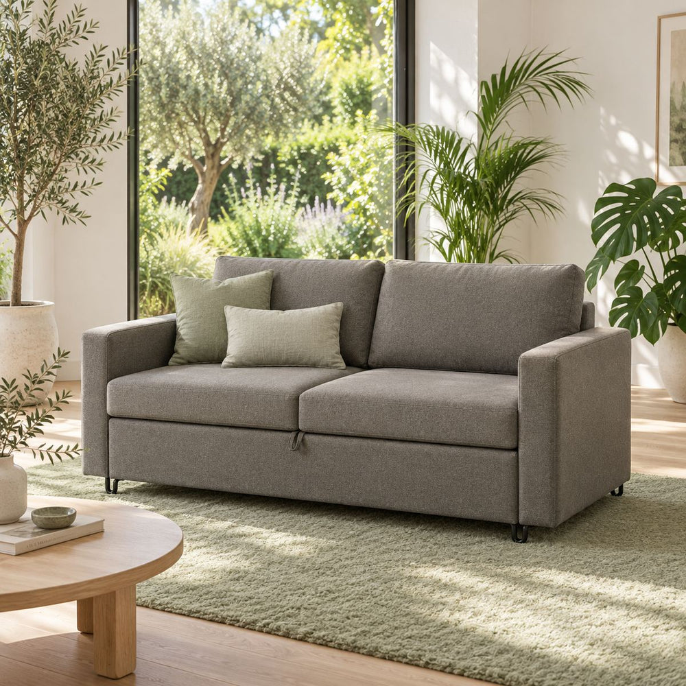 Storage Sofabed in a bright, plant-filled living room